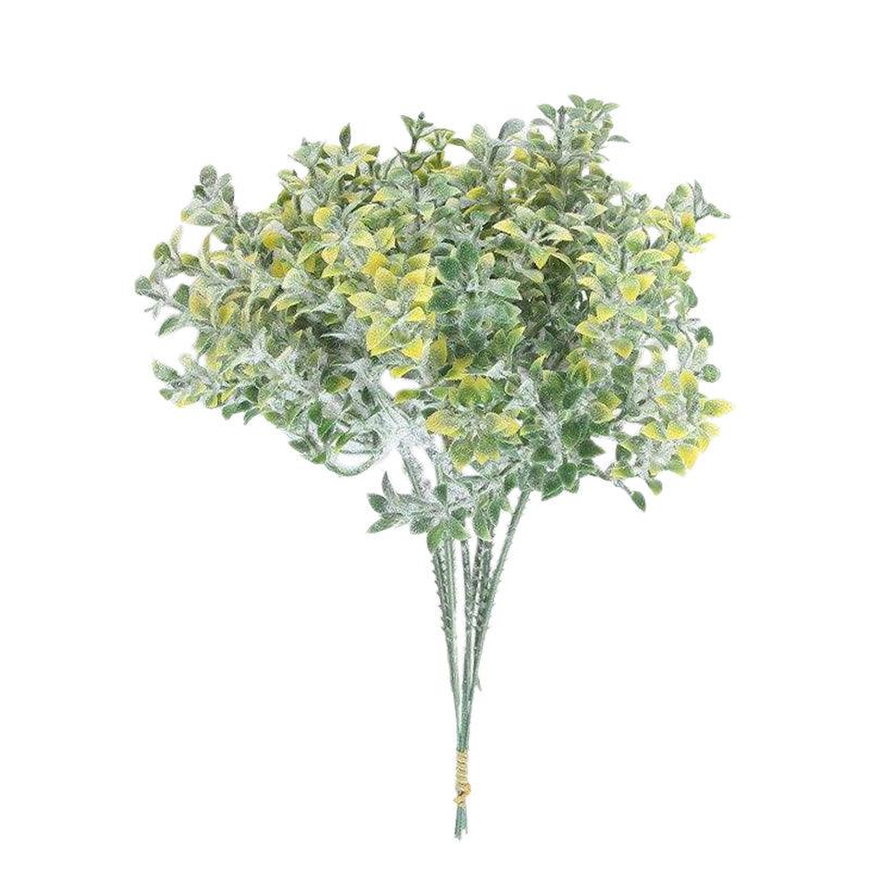 Cette image montre un bouquet de fleurs artificielles de couleur jaune