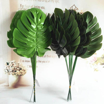 Cette image montre des feuilles de palmiers artificiel