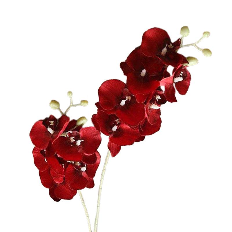 Cette image montre une orchidée artificielle de couleur rouge
