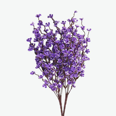 Cette image montre une fausse fleur. Cette fleur artificielle violette est une imitation d'un prunier